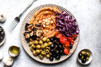 A veggie, hummus and olive sharing platter