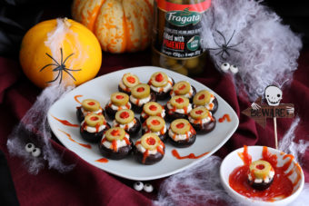 Spooky halloween eyeball snacks made from olives and mushrooms