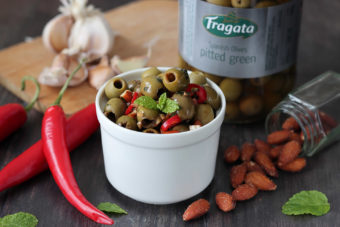 Fragata green stoneless olives with a chilli and almond marinade.